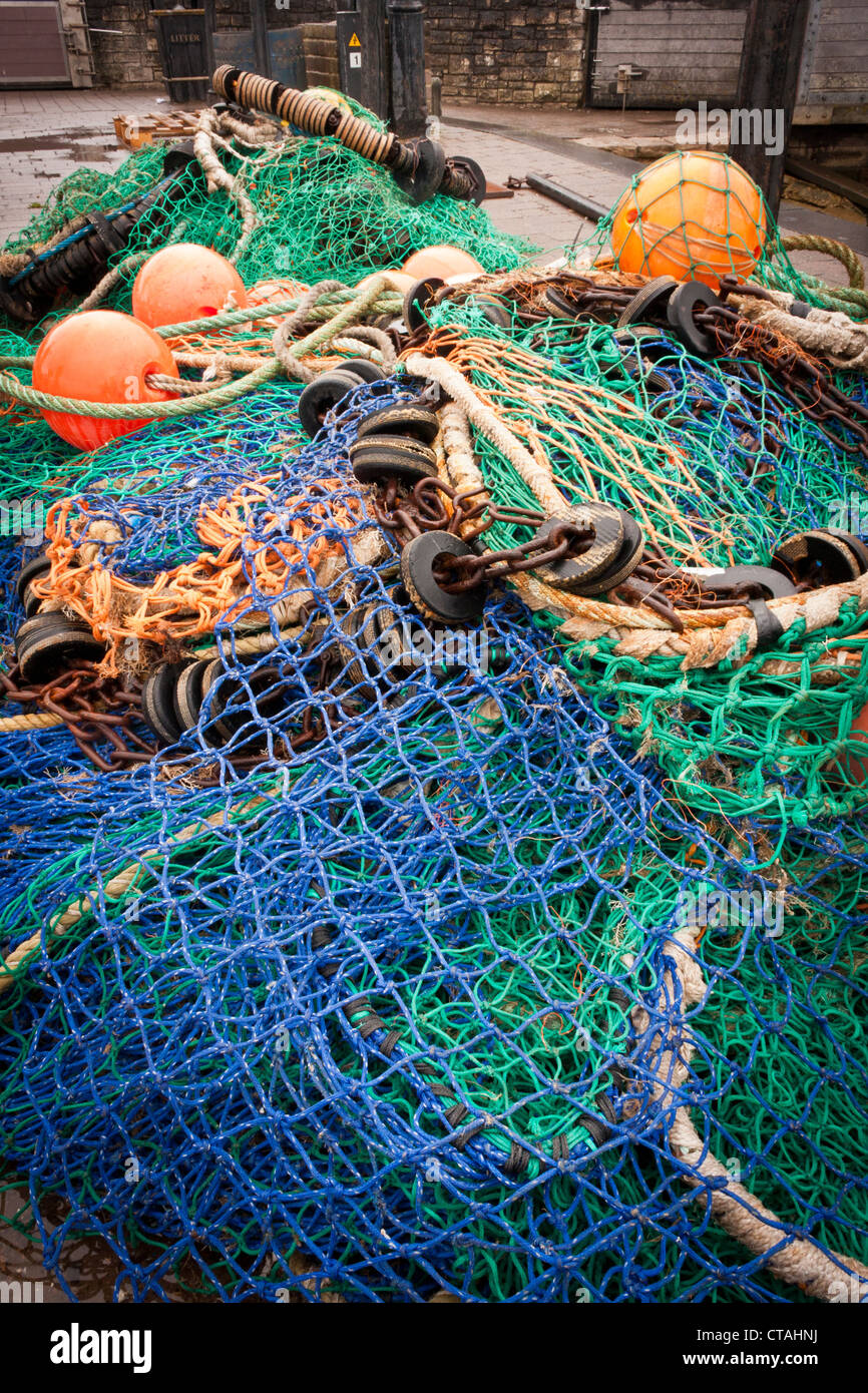 Fishing nets on a quayside in the English seaside town of Lymington, Hampshire. Stock Photo