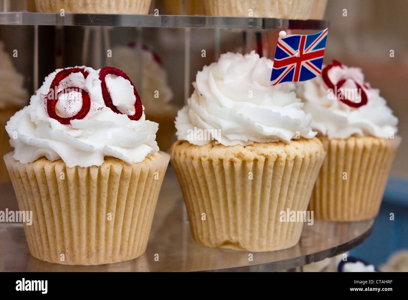 Queen Elizabeth II diamond jubilee celebration fairy cakes or cupcakes in a bakery window. Stock Photo
