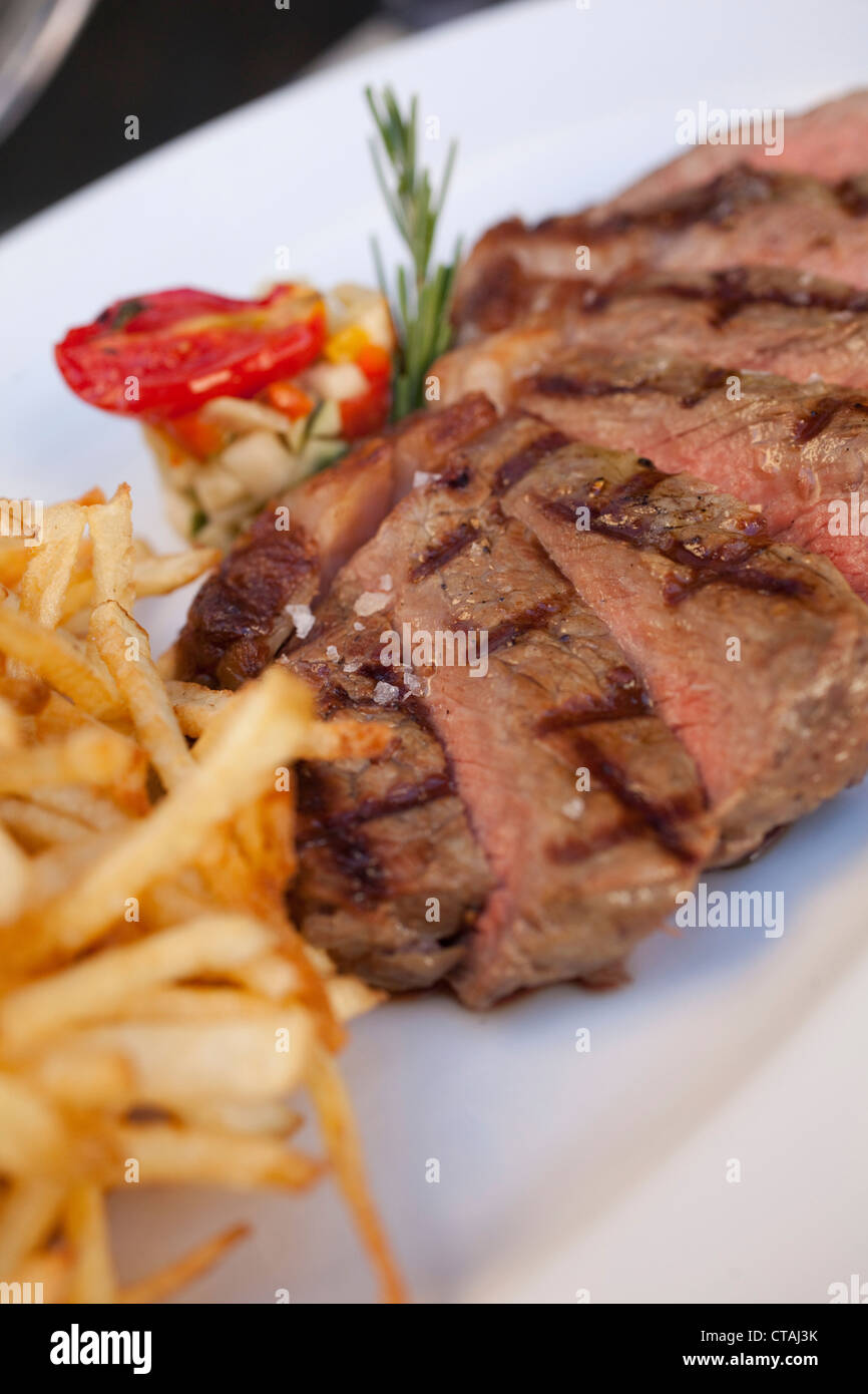 24 month Grass Fed Beef Sirloin 300gr with thin cut fries, Restaurant Carne SA, Cape Town, Western Cape, South Africa Stock Photo