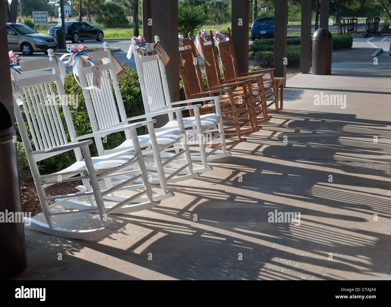 Naples Florida late afternoon sun shines through the line up of rocking ...