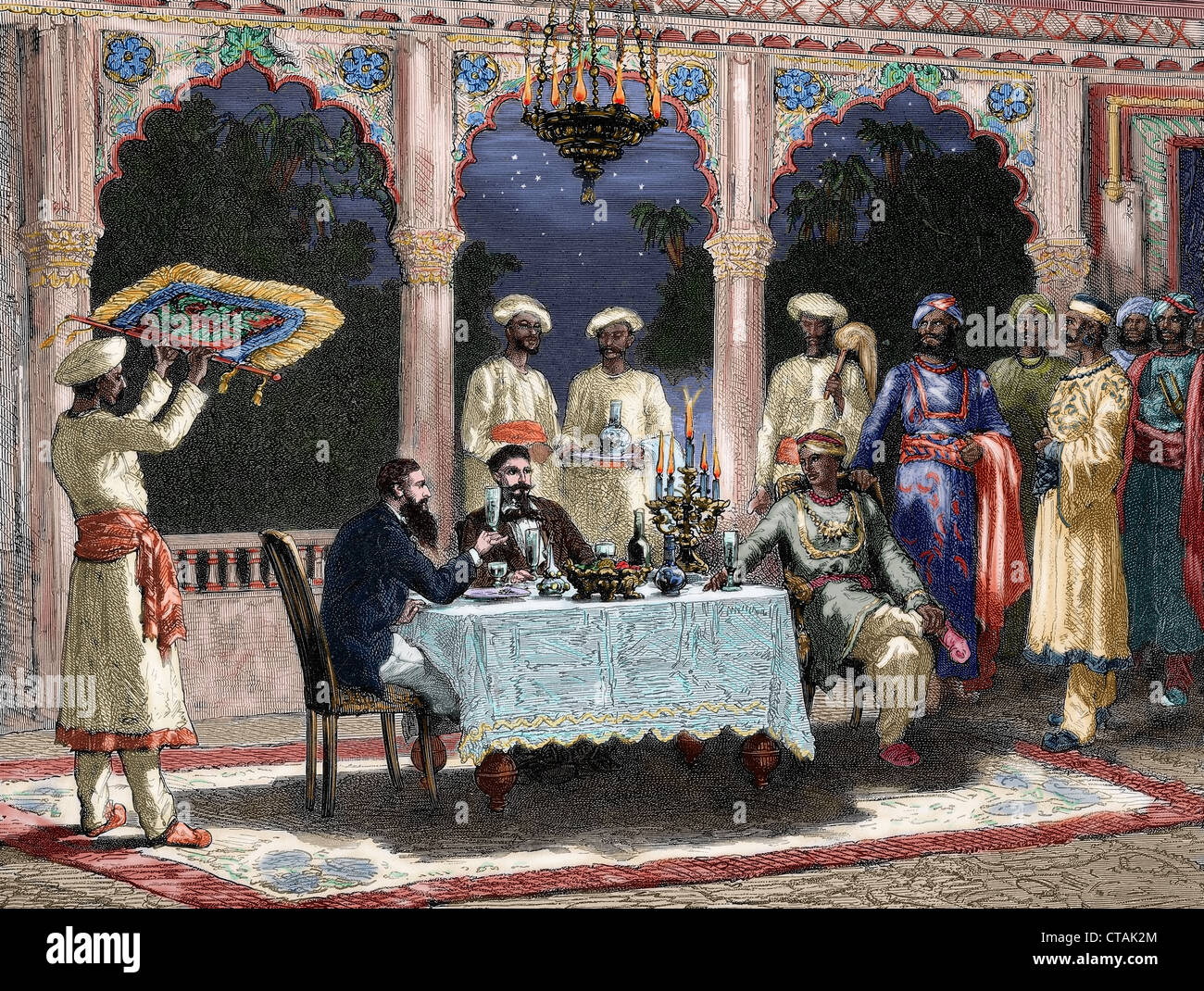 India. British colonial era. Banquet at the palace of Rais in Mynere. Engraving by Hildibrand. Colored. Stock Photo