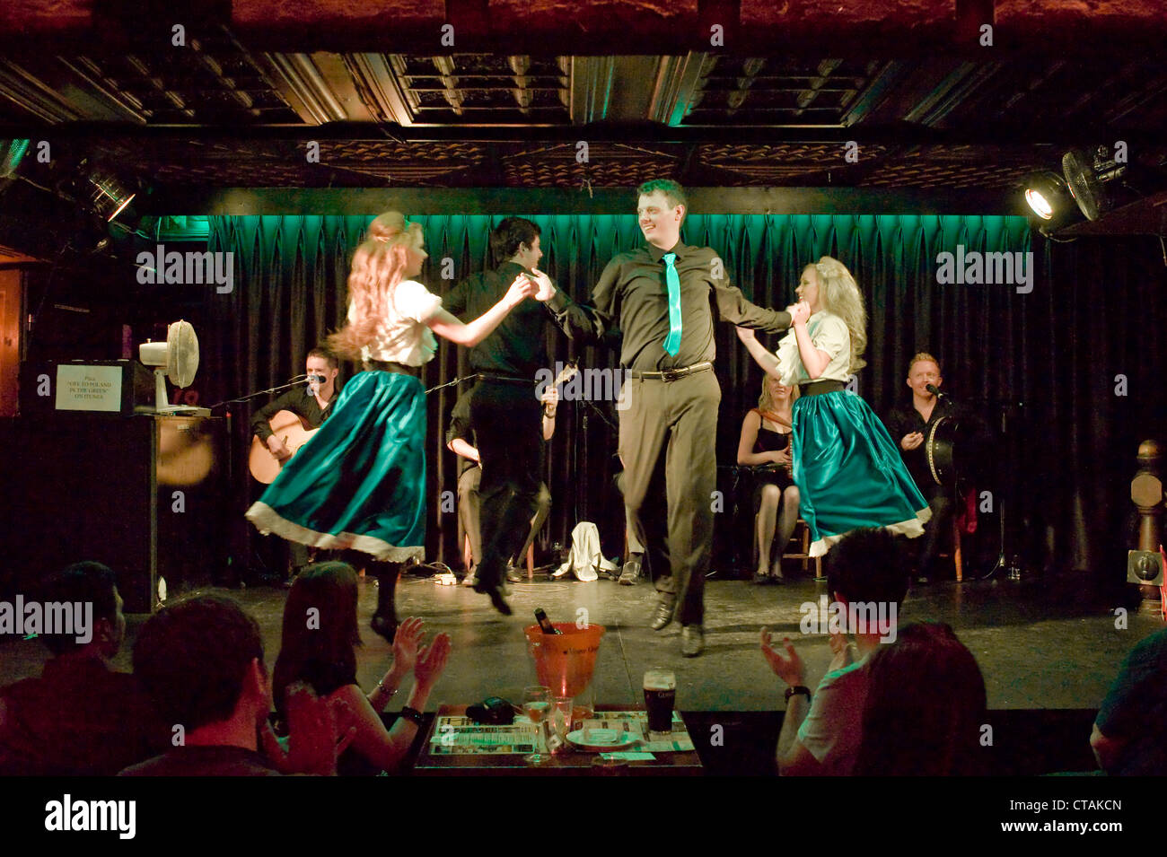 Members of the 'Celtic Rhythm Professional Irish Dancers' on stage with backing music by 'Puca' at the Arlington Hotel, Dublin. Stock Photo
