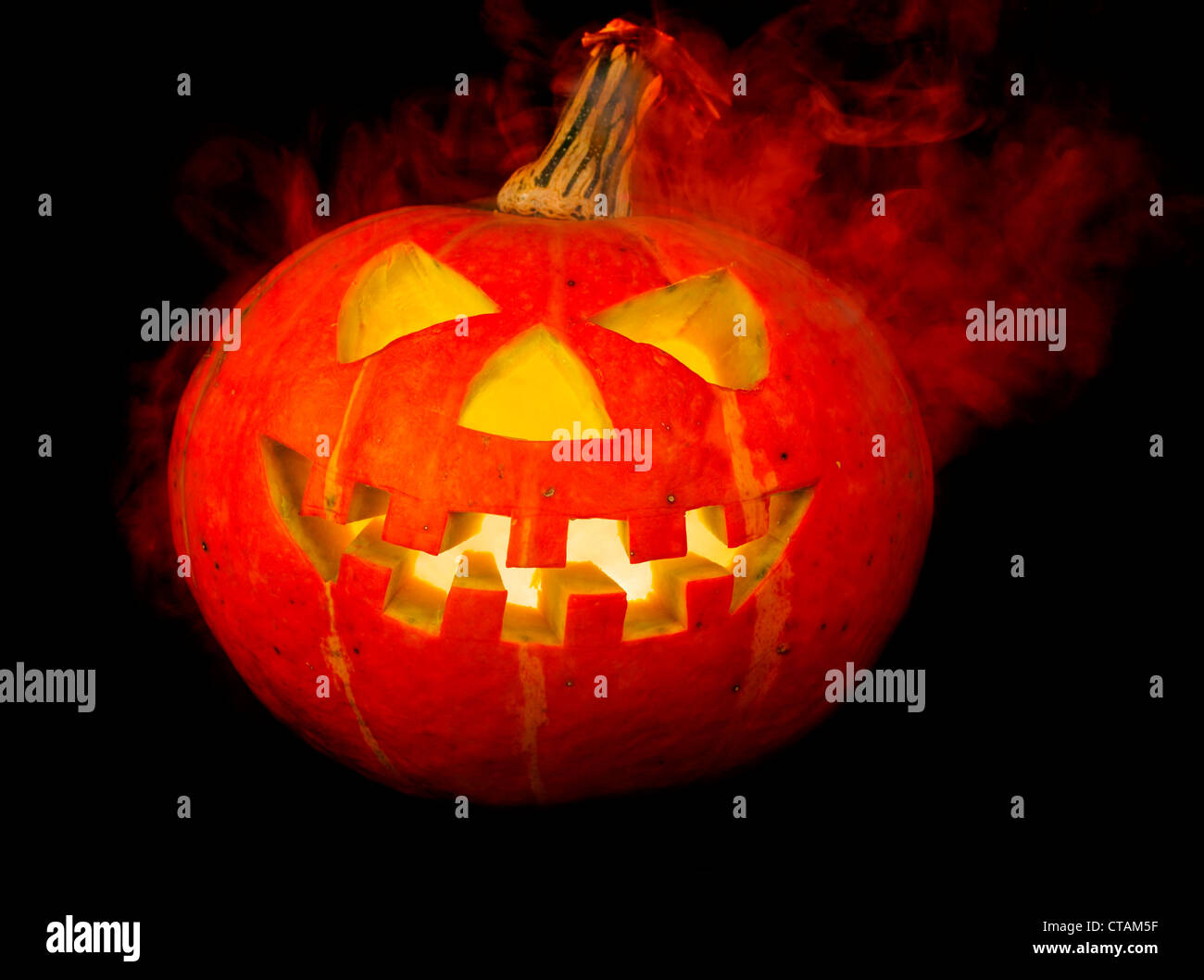 A scary old jack-o-lantern on black Stock Photo - Alamy