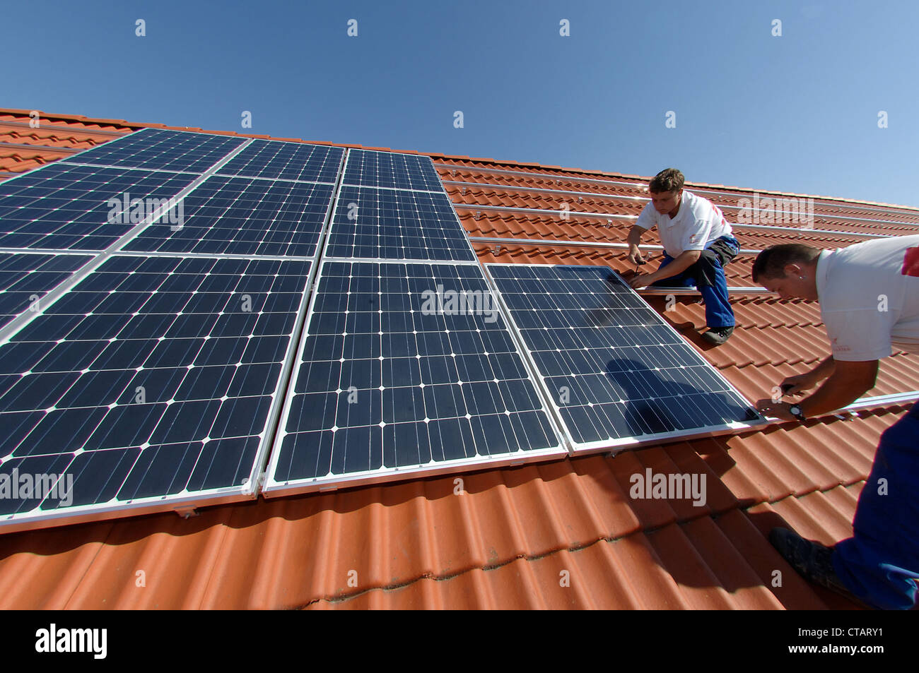 Installation of a photovoltaic system on the roof, Berlin Stock Photo ...