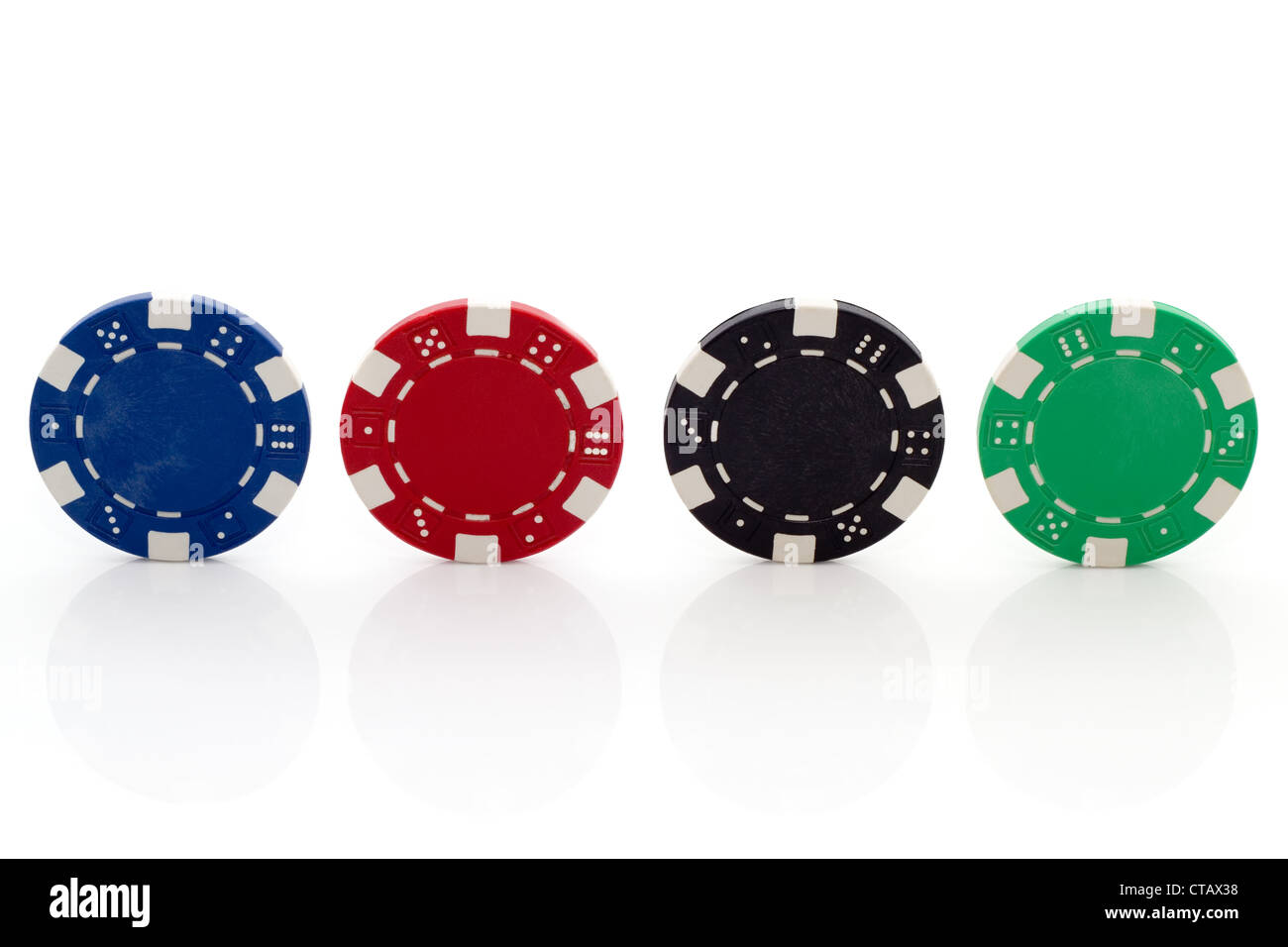 Four Different Poker Chips on White Background Stock Photo