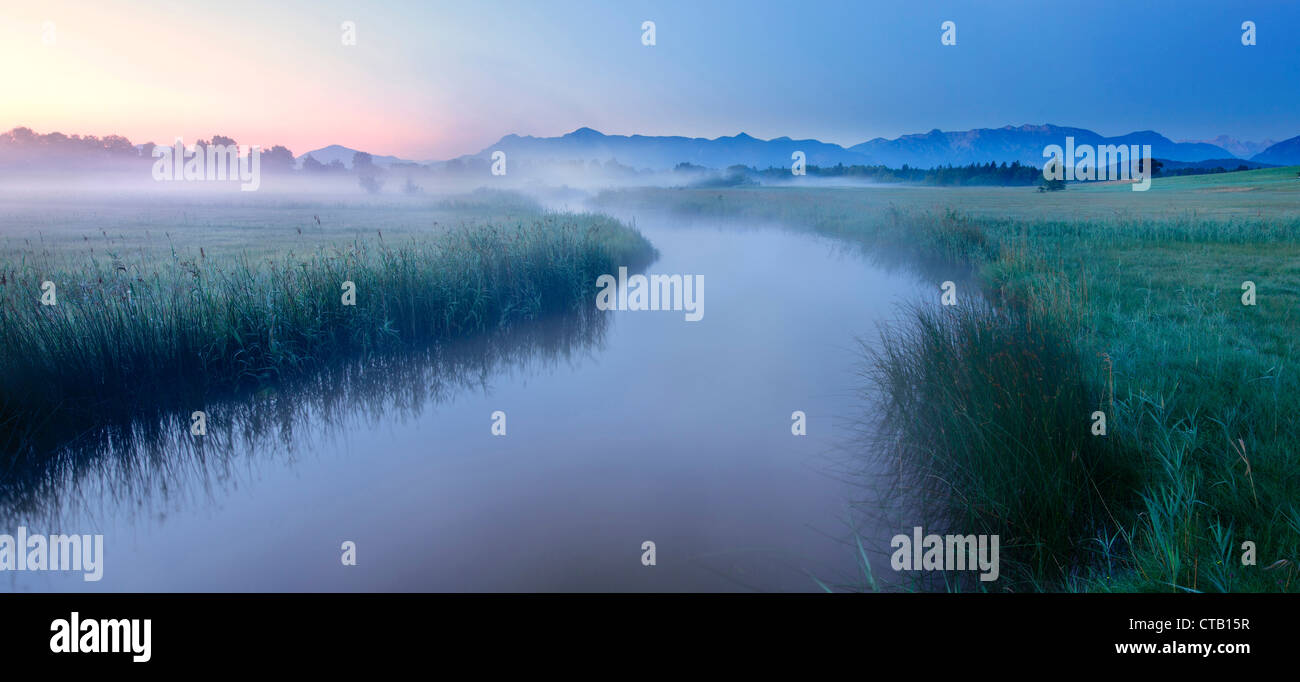 River Ach in early morning fog, Uffing, lake Staffelsee, Upper Bavaria, Germany Stock Photo