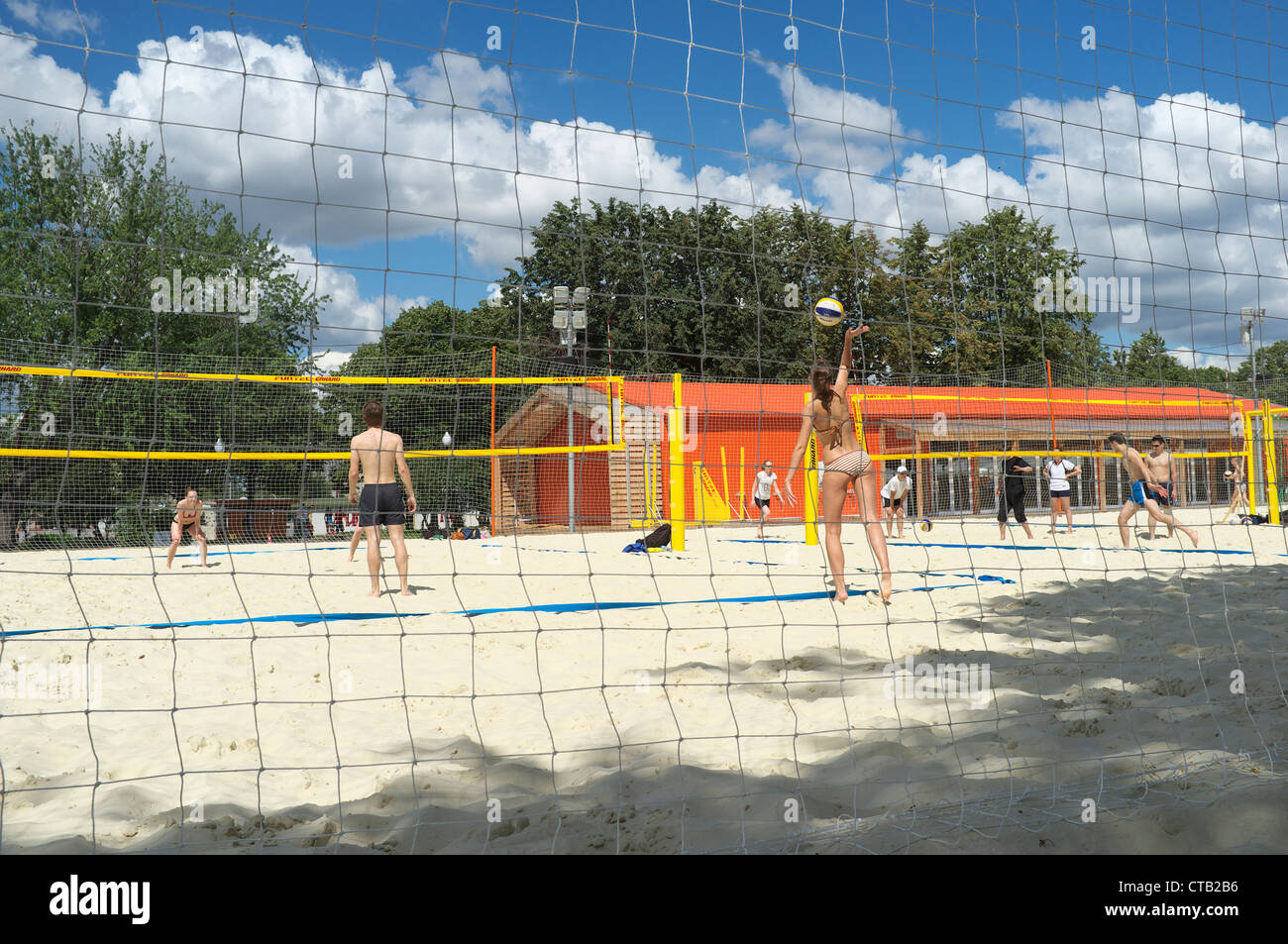 Young people playing volley-ball. Gorky Park, Moscow, Russia Stock Photo