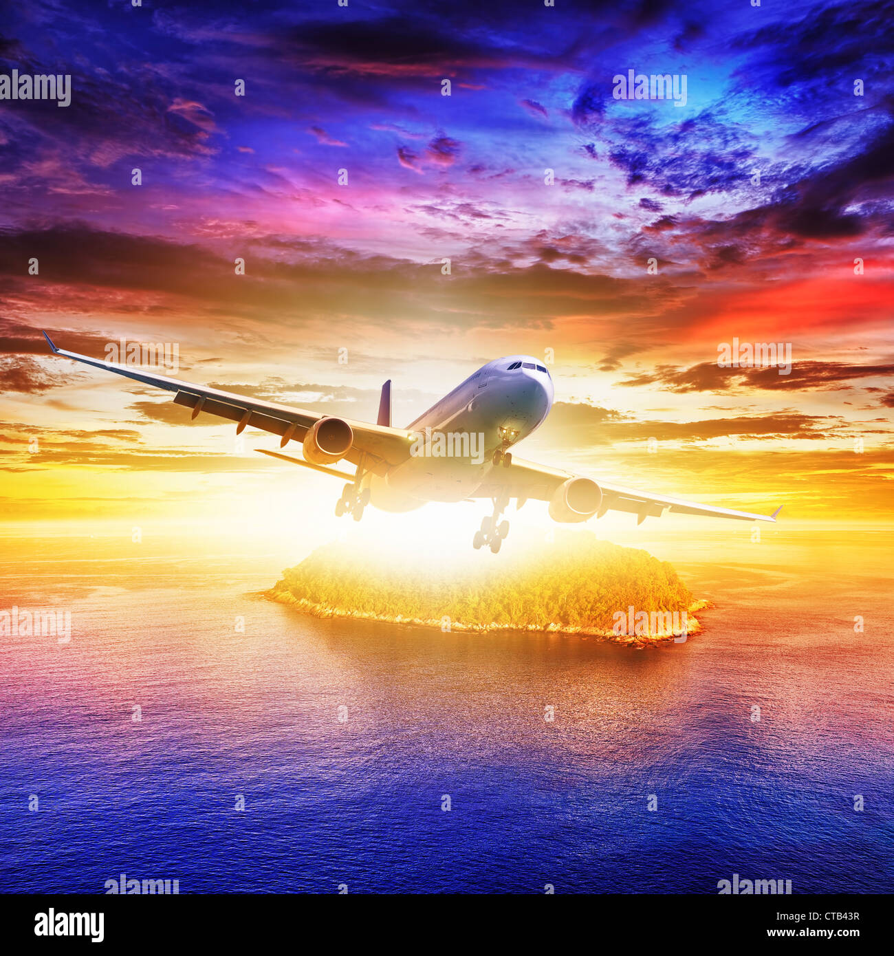 Jet plane over tropical island at sunset time. Square composition. Stock Photo