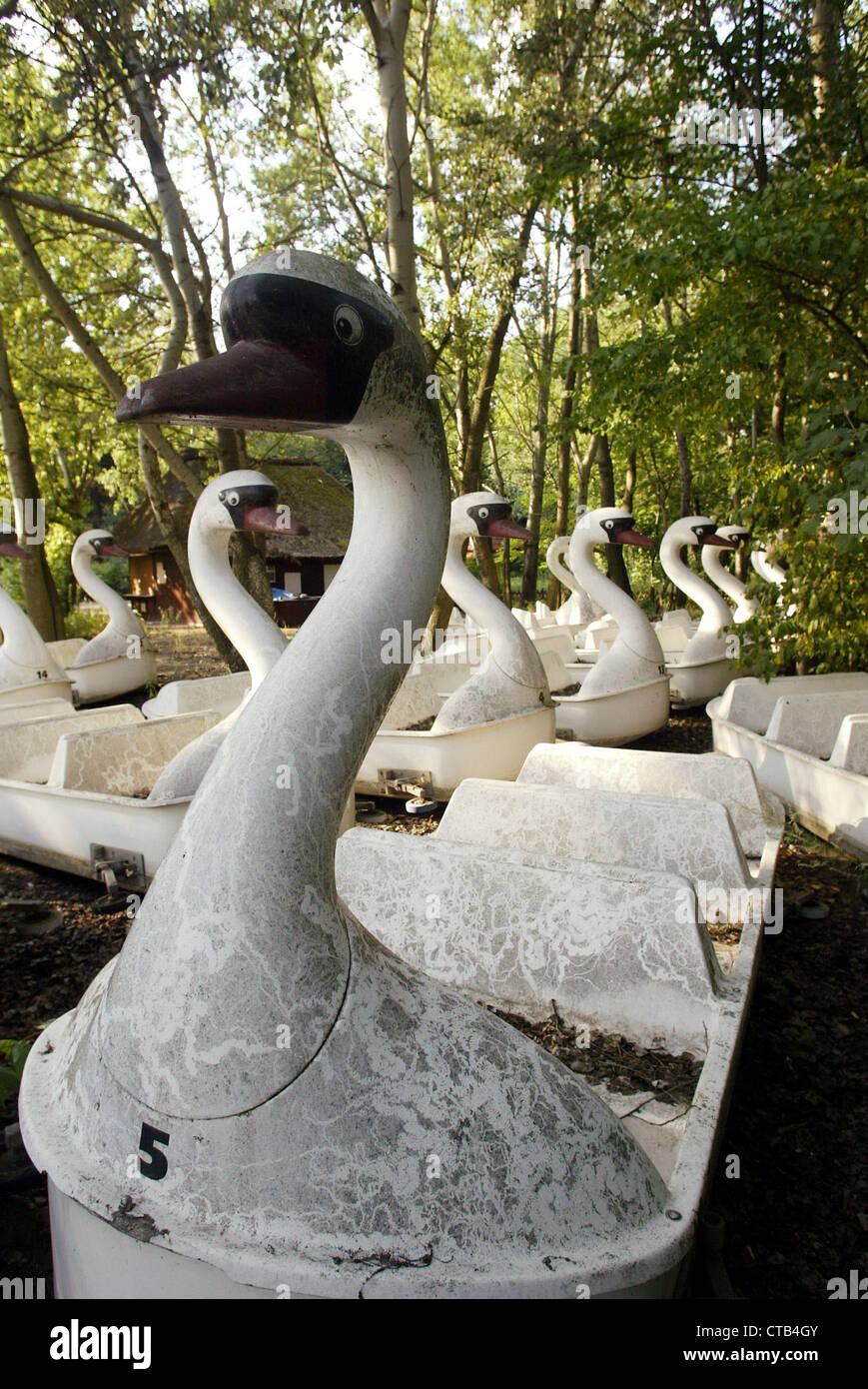 Swan gondolas in overgrown Spreepark Stock Photo