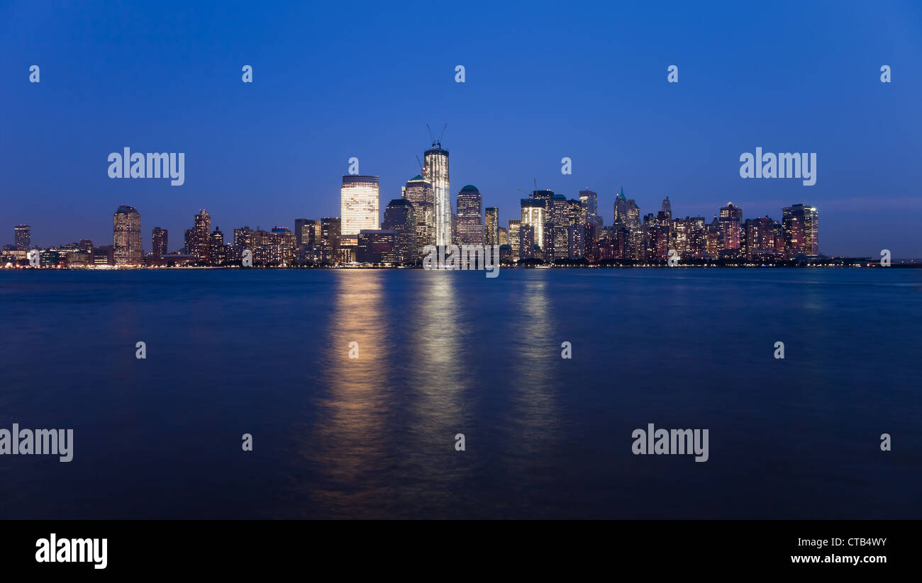 The New York City skyline at twilight w the Freedom tower Stock Photo ...