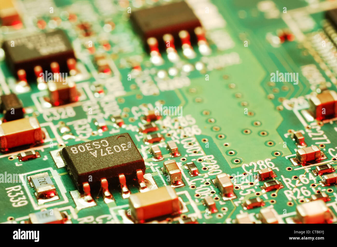 Close-up photo of computer circuit board; green red tone Stock Photo ...