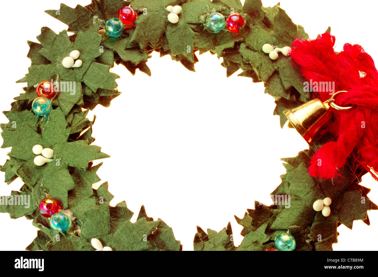 Wreath decorated with a small golden bell isolated on white background