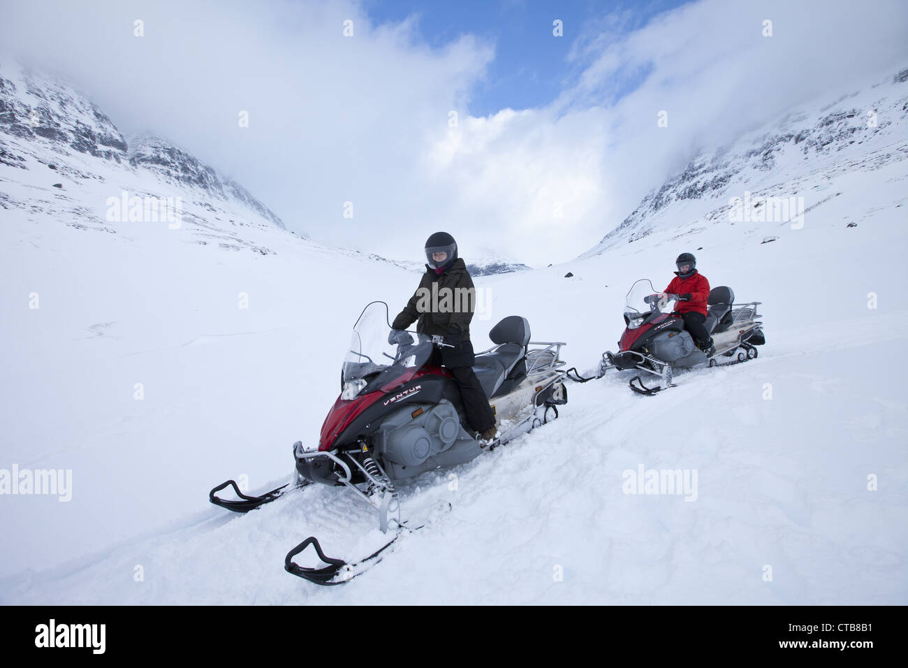 Snowmobiling in the arctic alps in the Arctic Circle near Holt in the ...