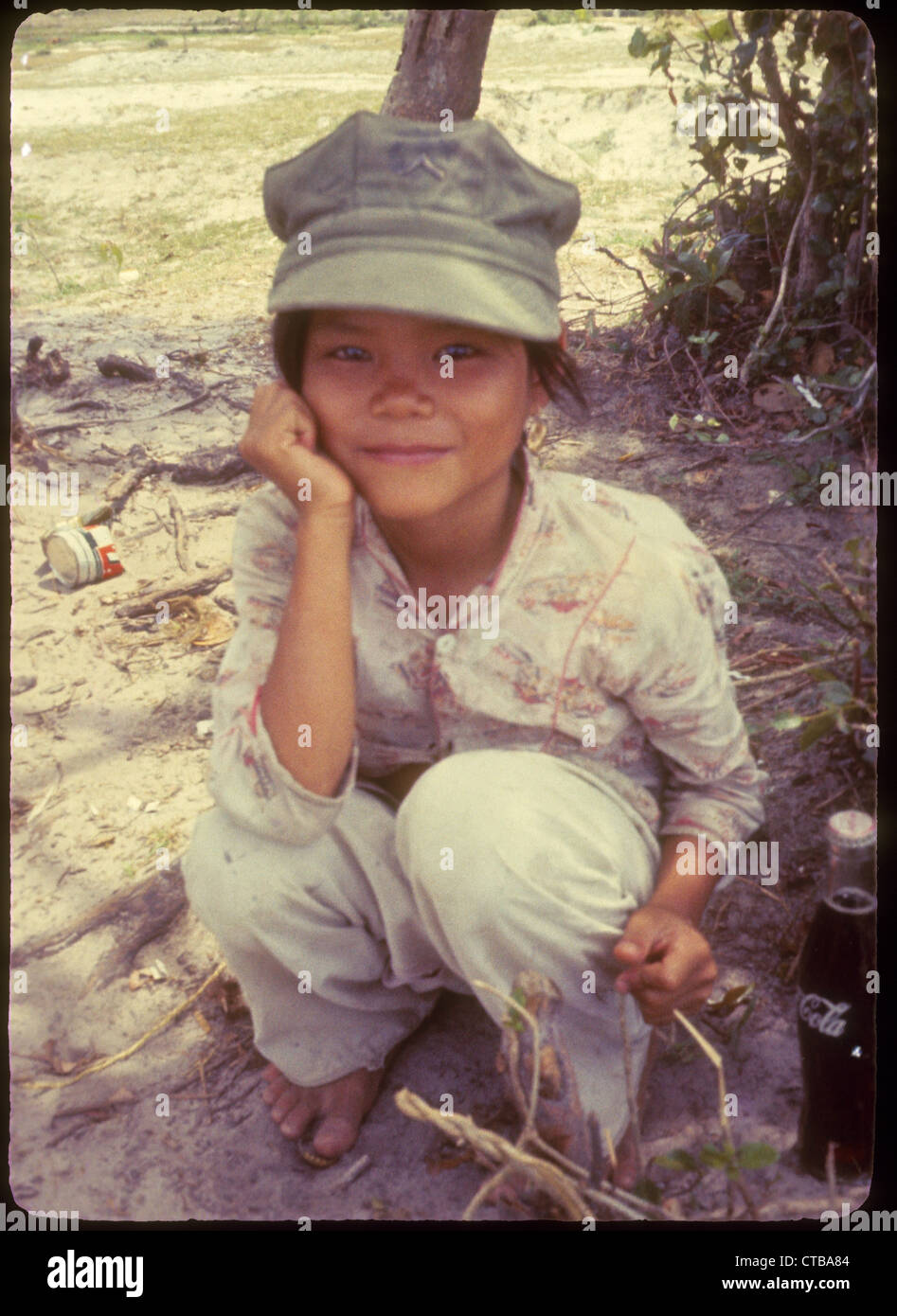 US Marines Vietnam War 1965 small child wearing cap hat Stock Photo