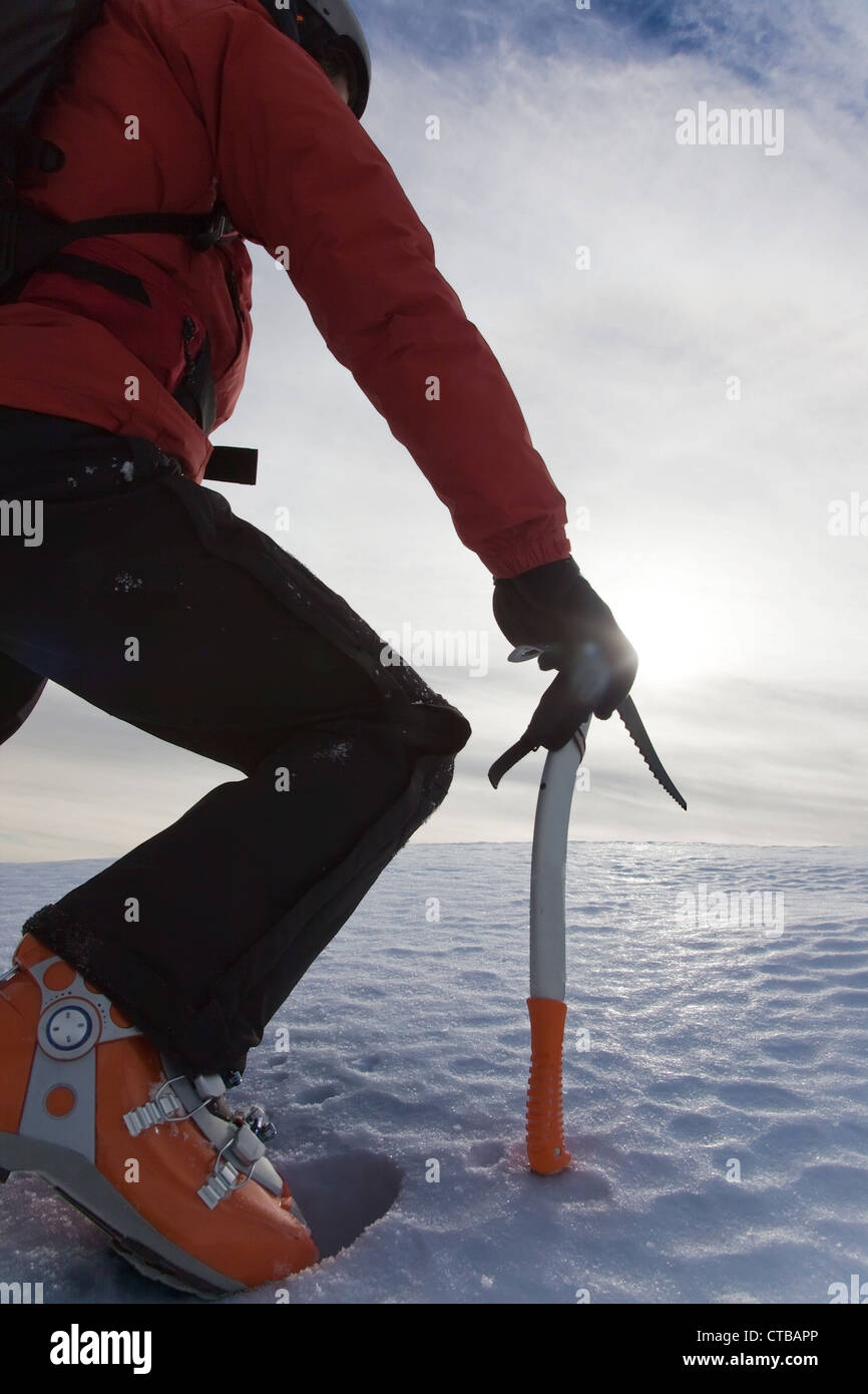 Lone male mountain climber climbing a snowy ridge; vertical frame Stock ...