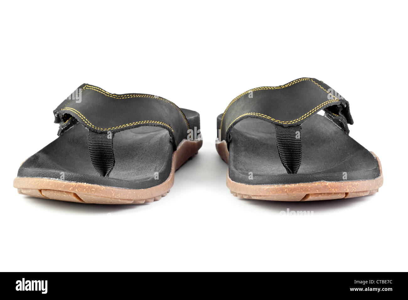 pair of black flip flops isolated on white background Stock Photo - Alamy