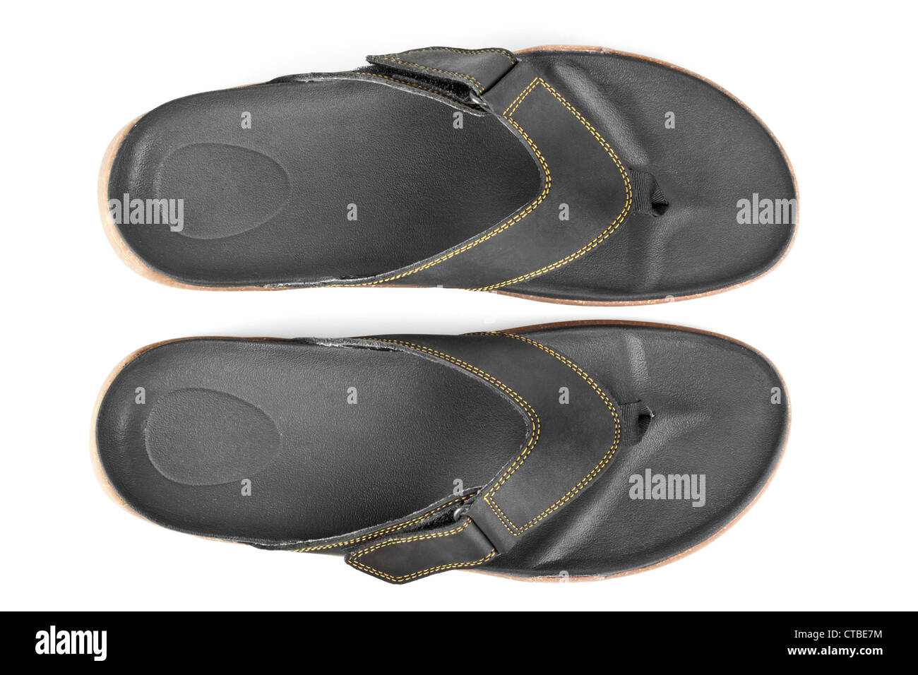 pair of black flip flops isolated on white background Stock Photo - Alamy