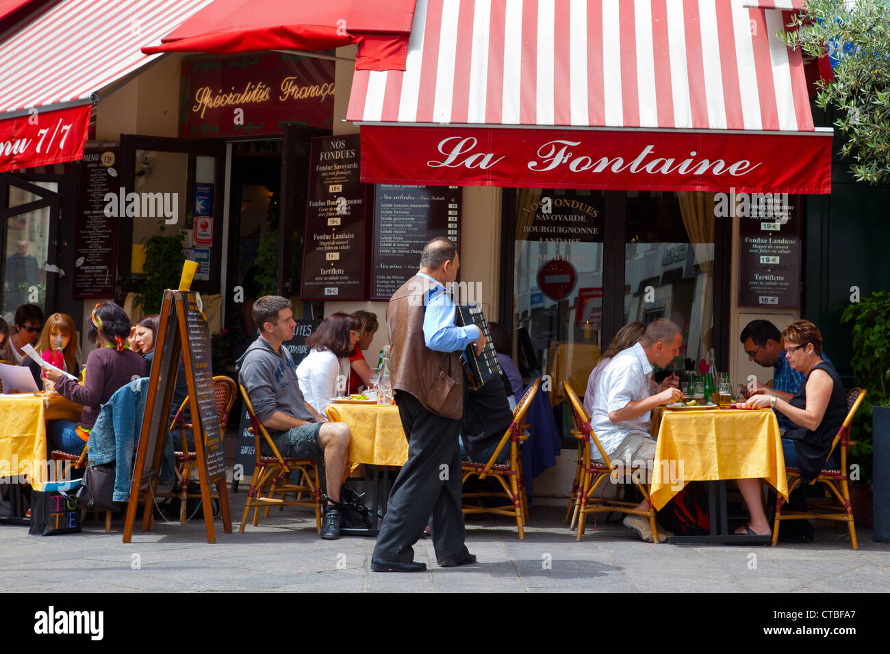Cafes line rue Mouffetard on the Left Bank of Paris France Stock Photo