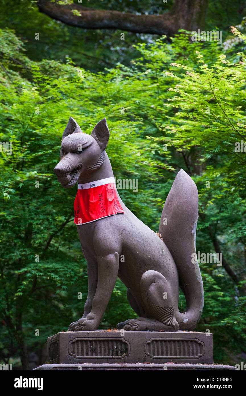 A statue of a kitsune (fox spirit) at the shrine of Fushimi Inaritaisha, Kyoto, Japan. They are