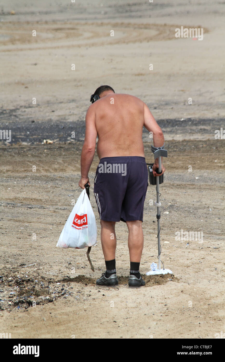 Man on beach with metal detector Stock Photo Alamy