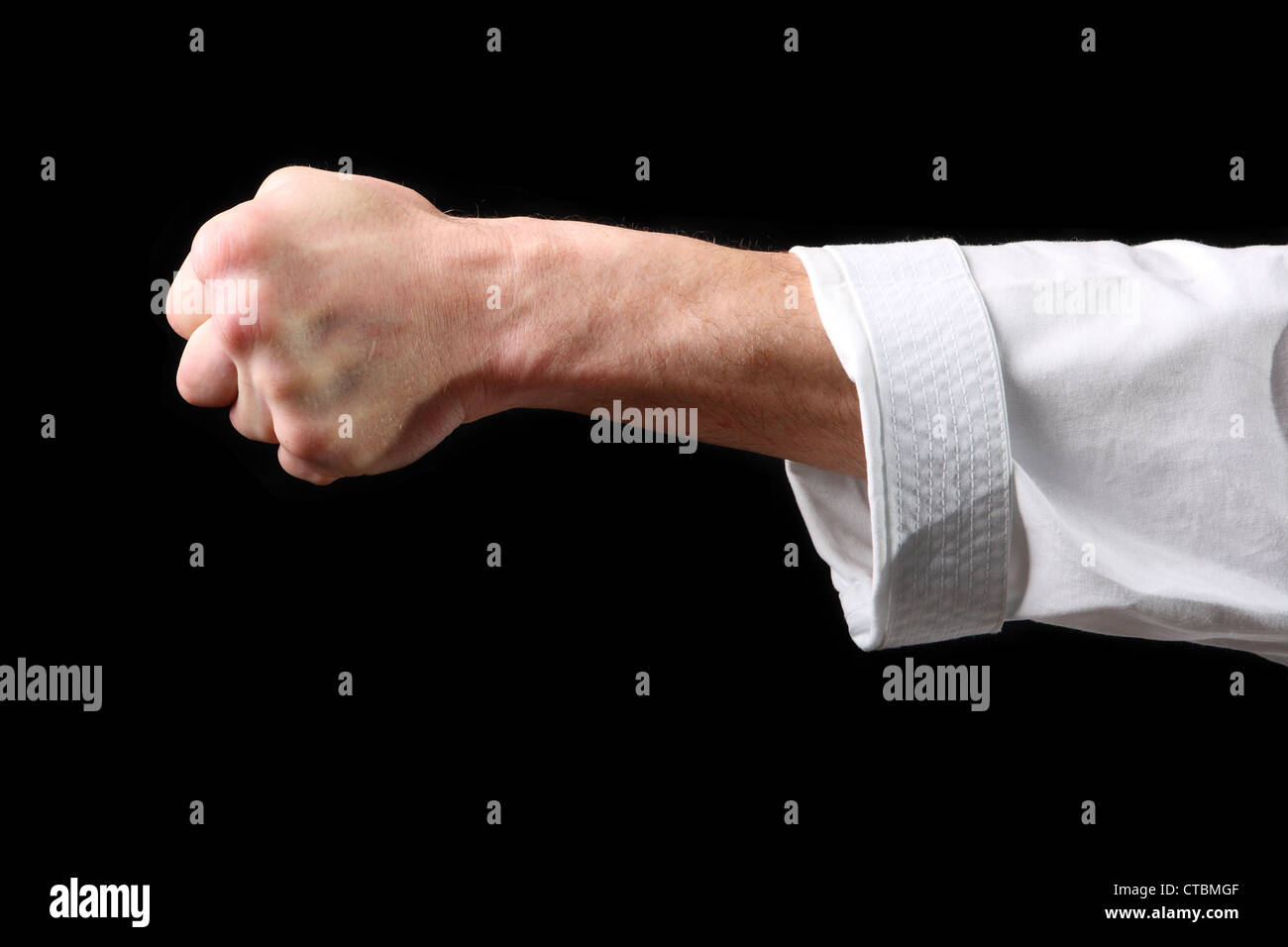 Fist. Hand fighter karate on the black background Stock Photo - Alamy