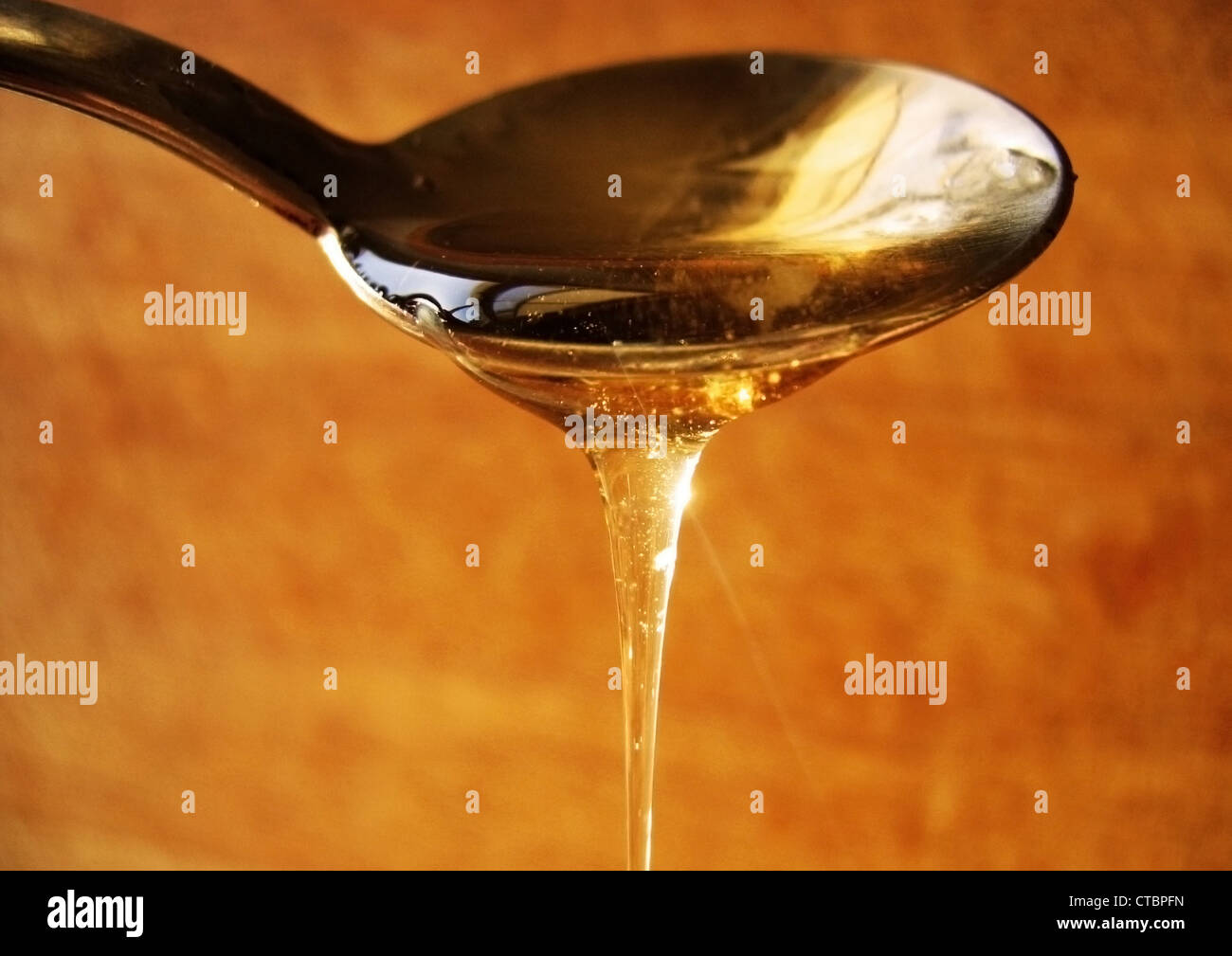 Honey with spoon Stock Photo Alamy
