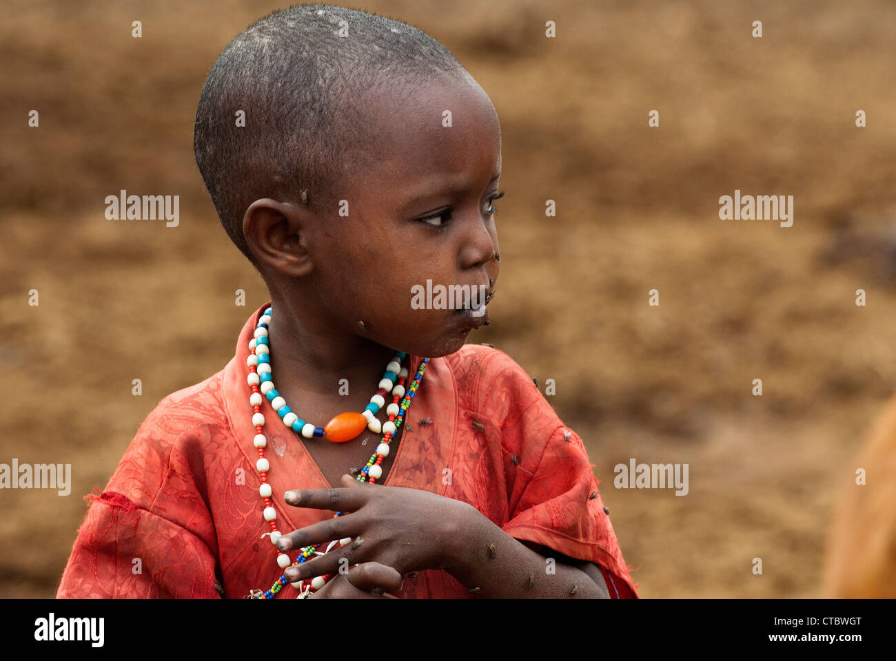Maasai child untroubled by flies Stock Photo