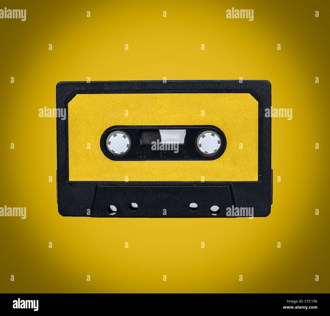 Retro cassette on yellow background Stock Photo Alamy