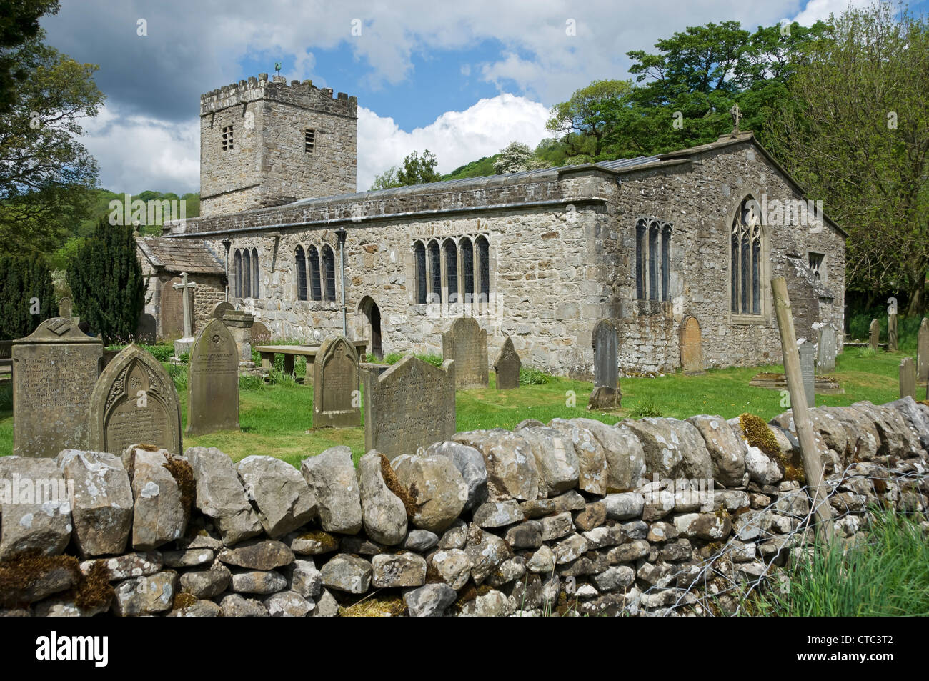 St Michael and All Angels Church and graves gravestones summer Hubberholme Upper Wharfedale North Yorkshire Dales National Park England UK Britain Stock Photo