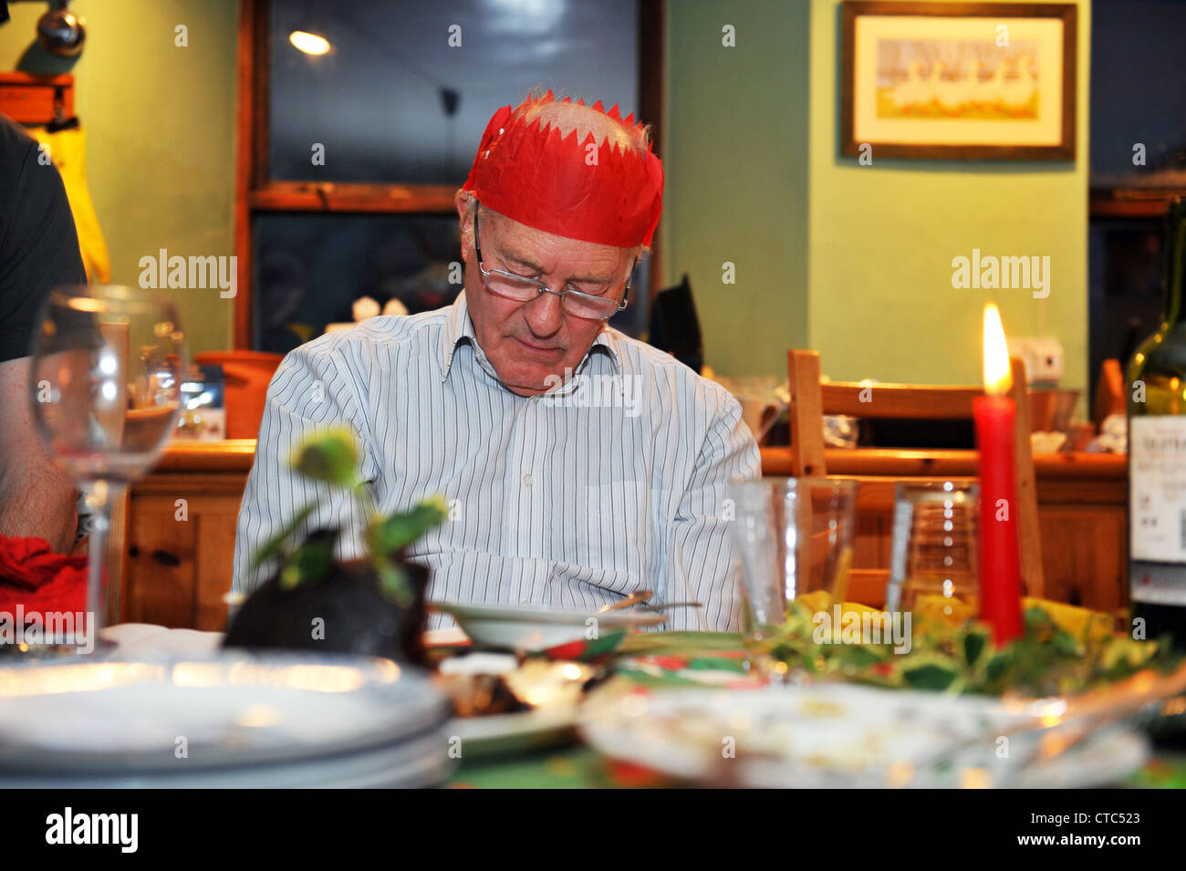 Grandpa falls asleep after Christmas dinner Stock Photo