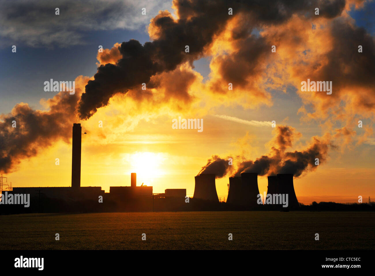 Smoke billows out of Drax Coal Fired Power Station, at early morning sunrise,North Yorkshire UK Stock Photo