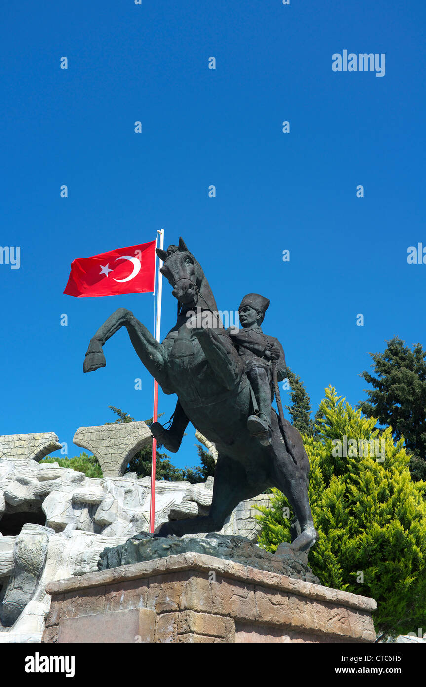 Statue of Atatürk on a horseback with the Turkish flag, in the town square, Belek, Antalya, Turkey Stock Photo