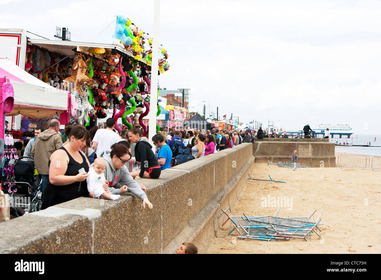 Tourists at Festival on Cleethorpes seafront coast resort sea sand