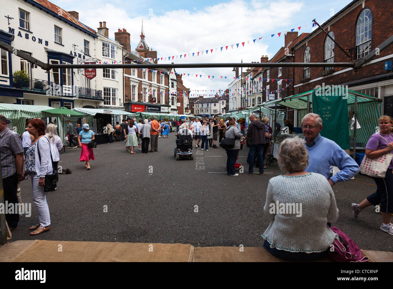 Market stall holders selling at Louth food festival Lincolnshire, UK
