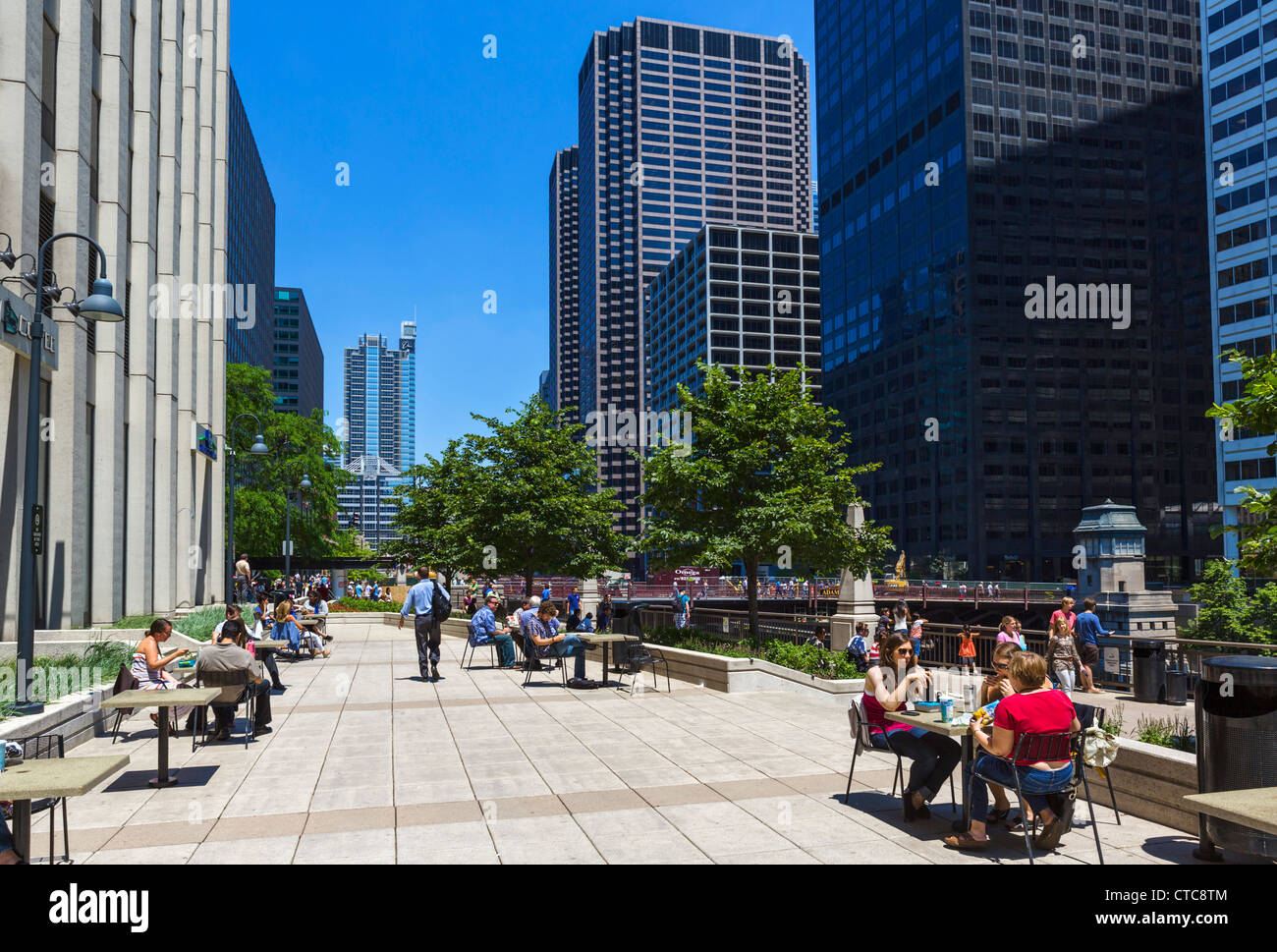 Office workers lunching on terrace of Caribou cafe outside Adams St entrance to Union Station, Chicago River, South Riverside Plaza, Chicago, IL, USA Stock Photo