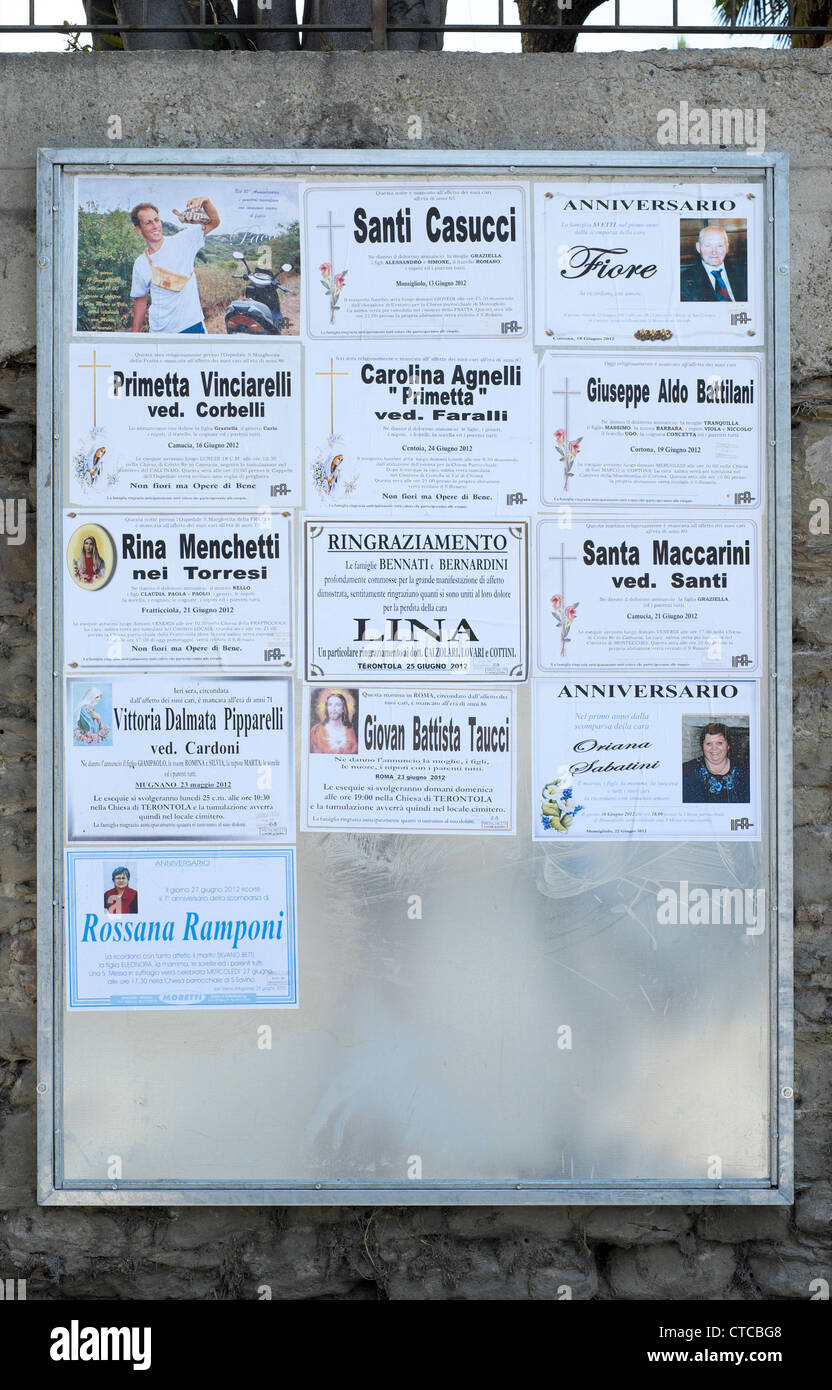 Italian posters and funeral notices on notice board Stock Photo Alamy
