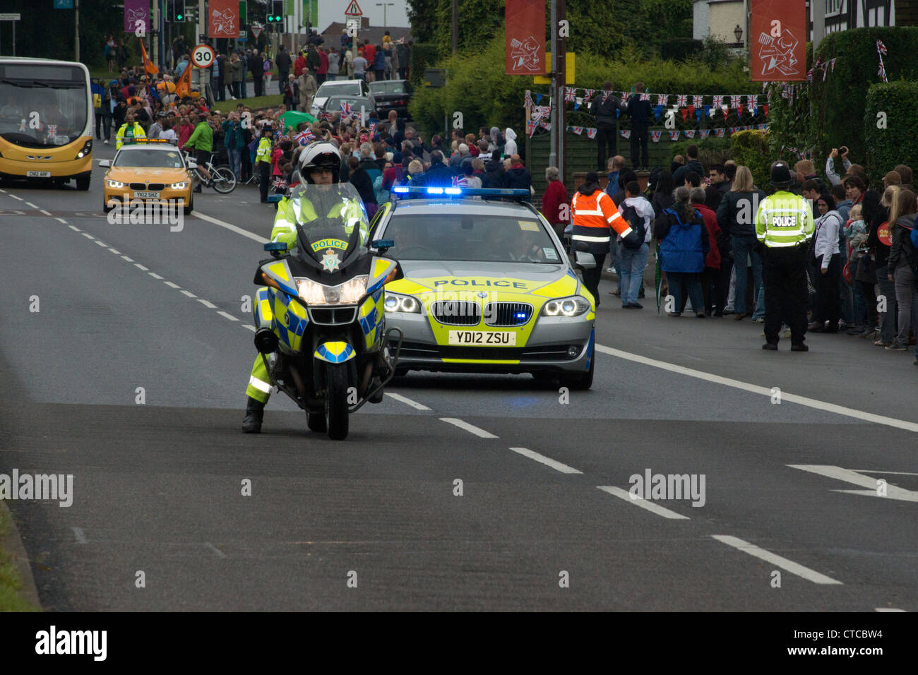 Police motorbike and car escort of the Olympic relay, A6,Oadby