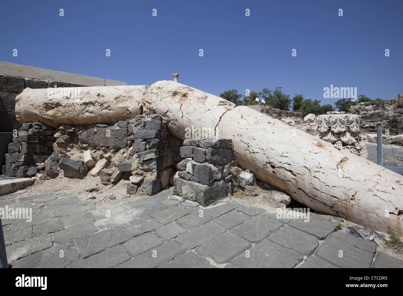 Columns toppled by a massive earthquake on January 18, 749 CE in the ancient Roman city of Beit She'an (Scythopolis), Israel. Stock Photo