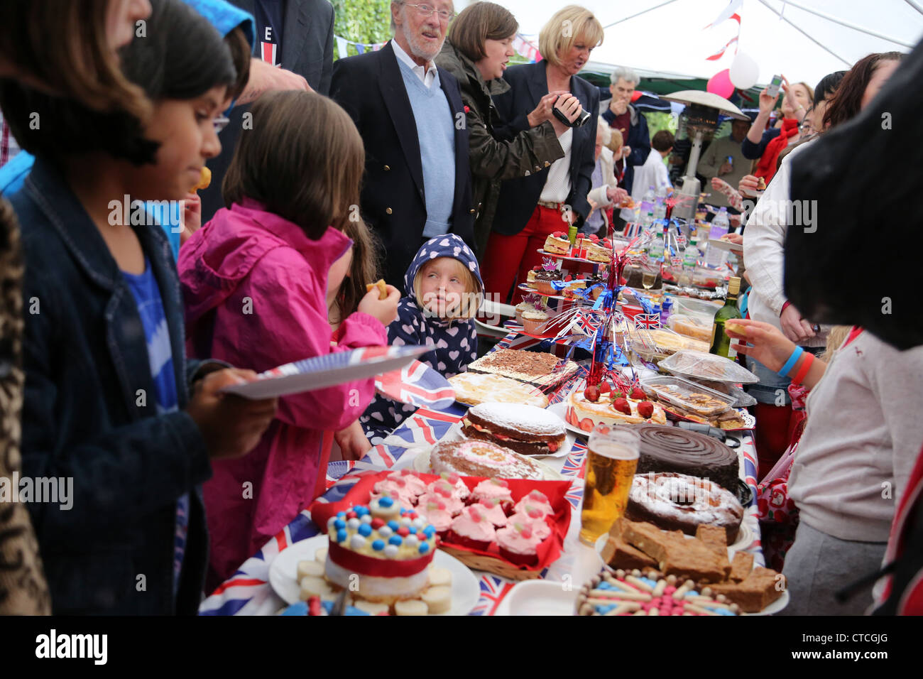 Cake Competition At Street Party And People Eating During Queen's