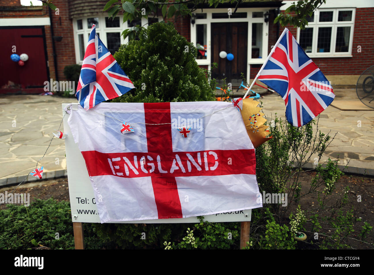 England St Flag And Union Jacks Outside House For The Queen's