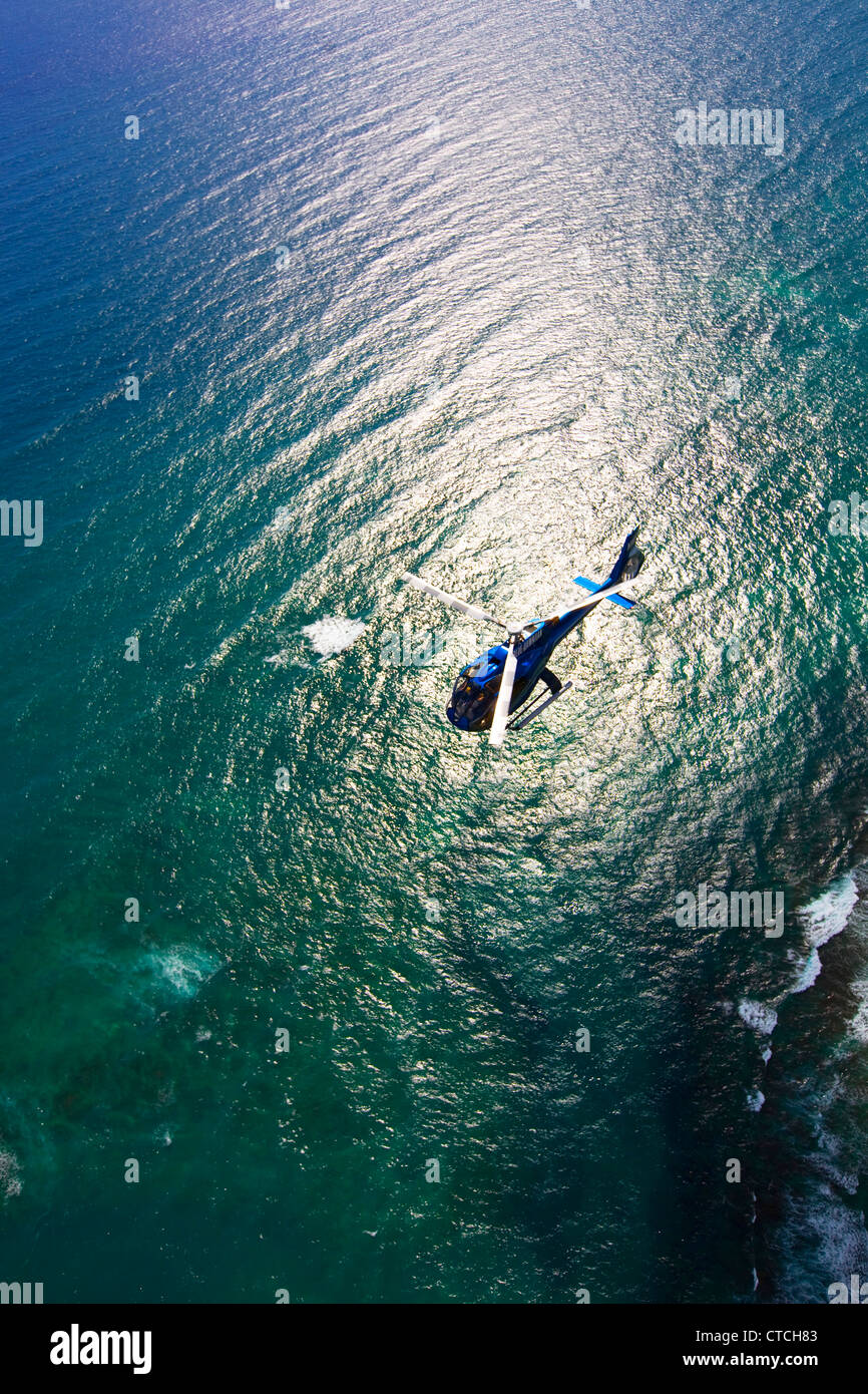 Helicopter over reef, Hawaii Stock Photo