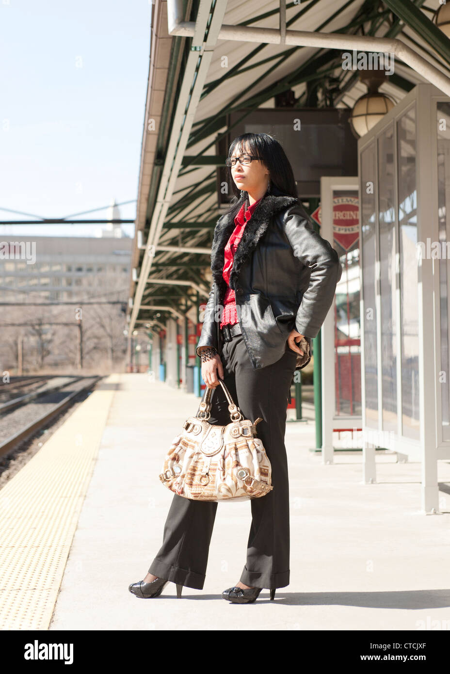 A woman waiting for a train Stock Photo
