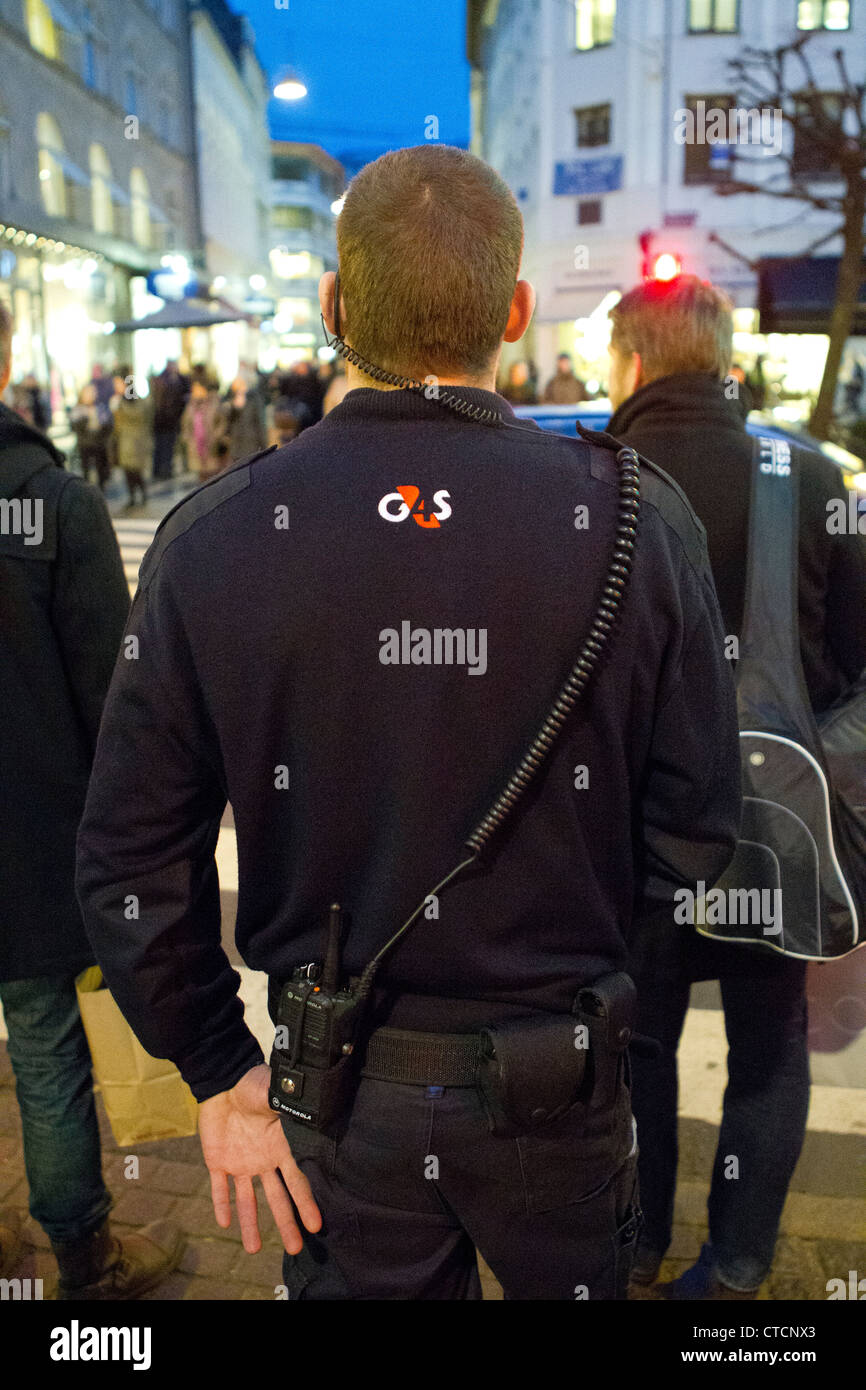 a member of G4S security company patrolling the streets Stock Photo