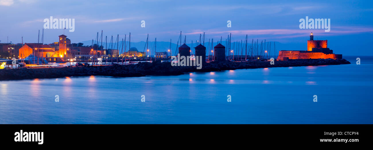 Night shot of Mandraki harbour Rhodes Greece. Stock Photo