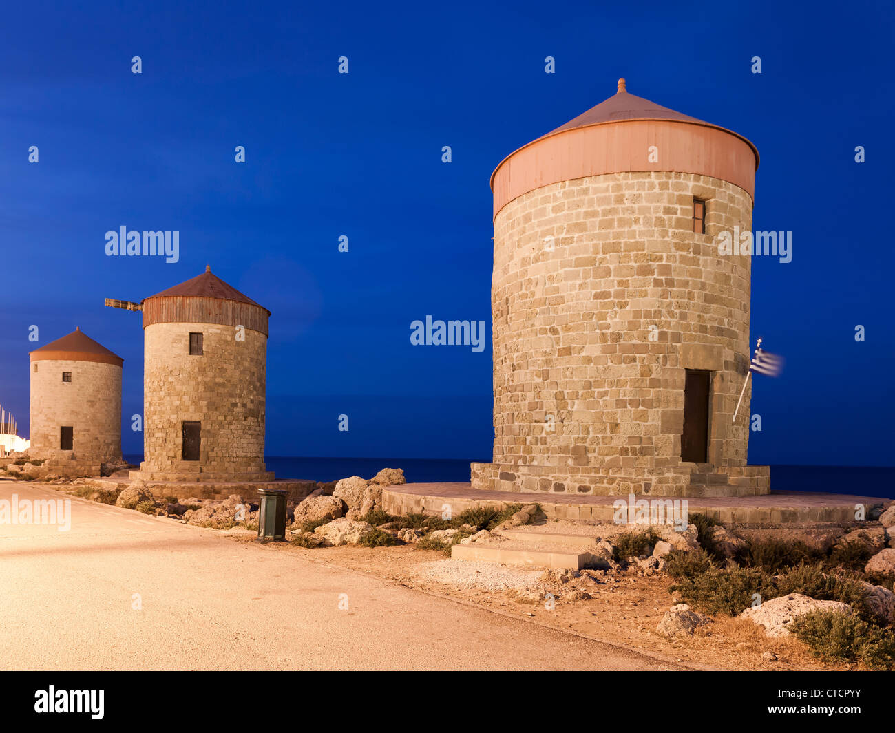 The famous windmills at Mandraki Harbour, Rhodes Greece Stock Photo
