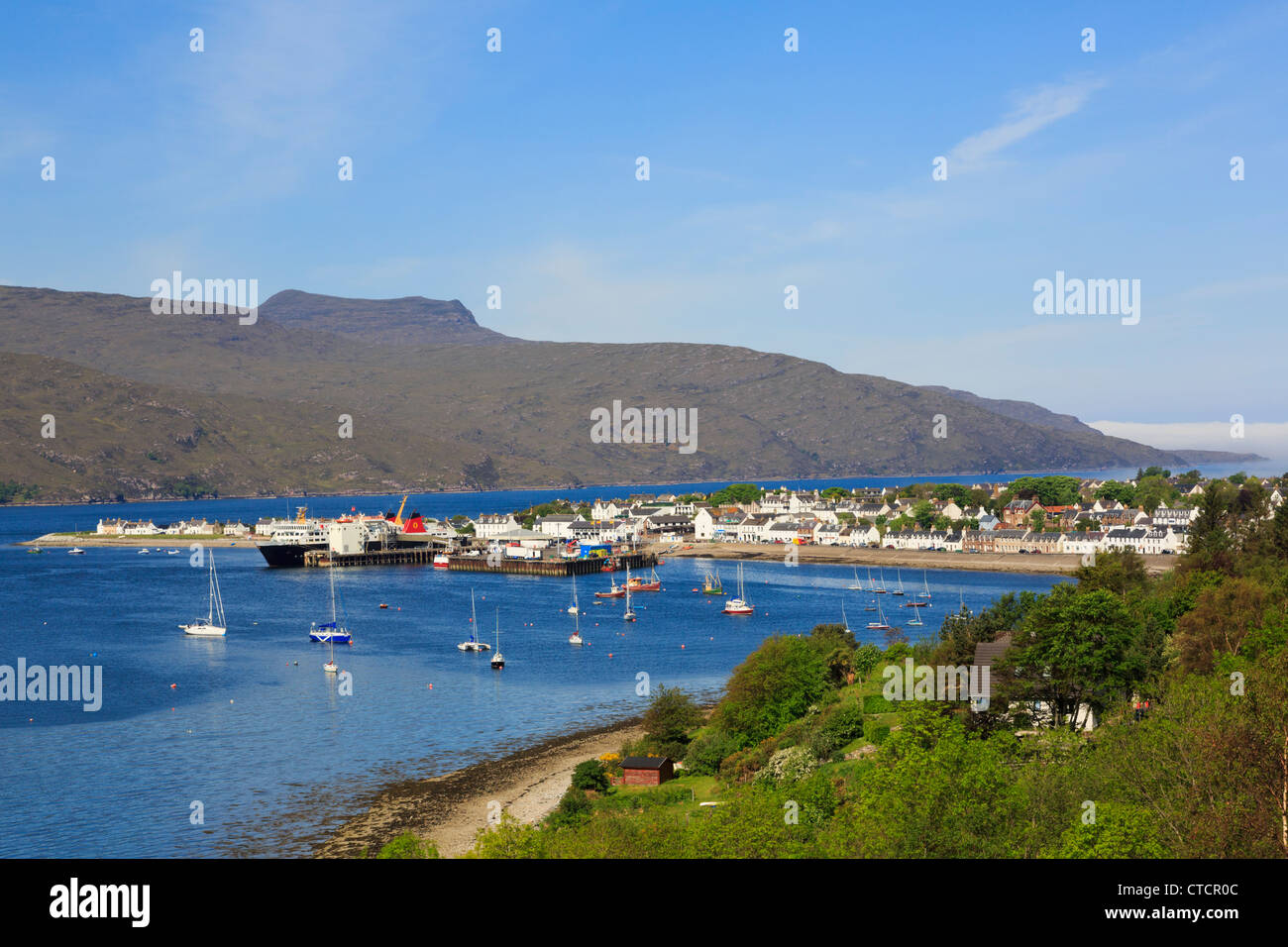 View to fishing port on Loch Broom with ferry in dock on north west coast Ullapool Wester Ross Ross and Cromarty Scotland UK Stock Photo