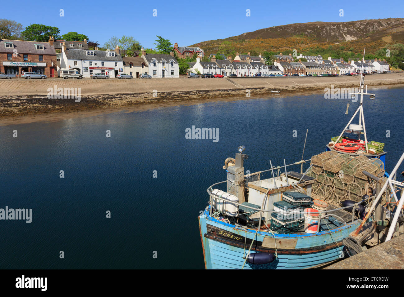 Boat with lobster pots in Loch Broom fishing harbour on northwest highlands coast at Ullapool Wester Ross Highland Scotland UK Stock Photo