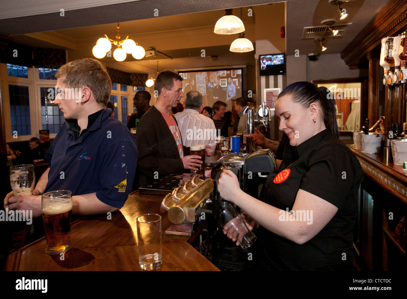People enjoying themselves in the Old Clarence Pub, Earlsdon, Coventry on the opening night of a refurbishment. Stock Photo