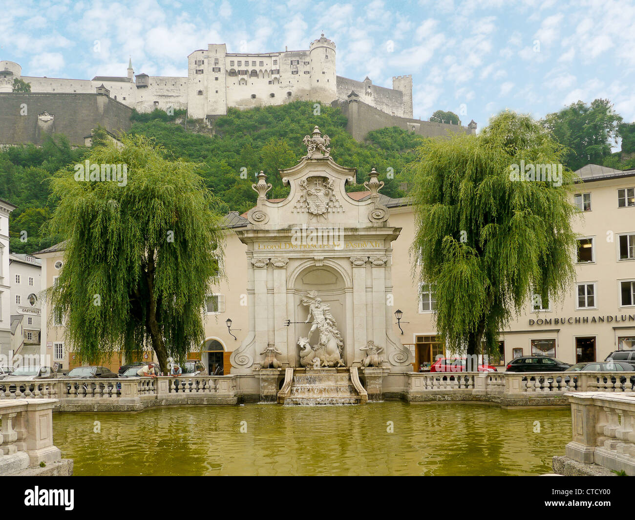 Monument in a water garden with the Hohensalzburg Fortress in the background, Salzburg, Austria Stock Photo