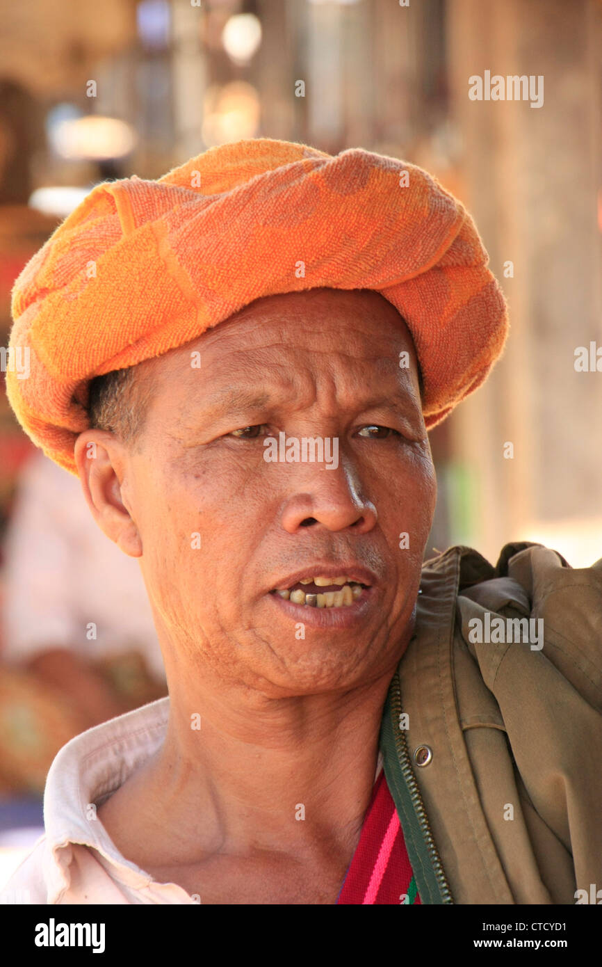 Portrait of burmese man wearing orange turban, Inle lake, Shan state, Myanmar, Southeast Asia Stock Photo